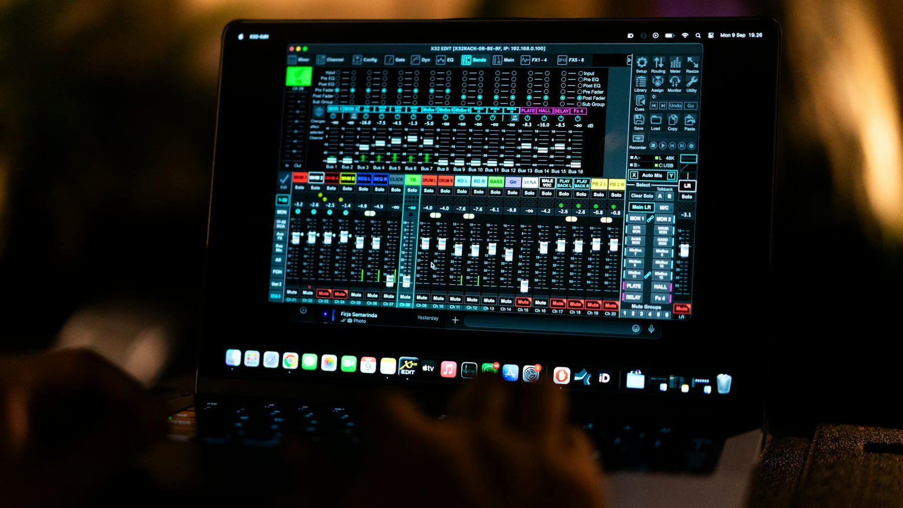 Close-up of a digital audio mixing software interface on a laptop screen in a recording studio. on The Tech Shelf