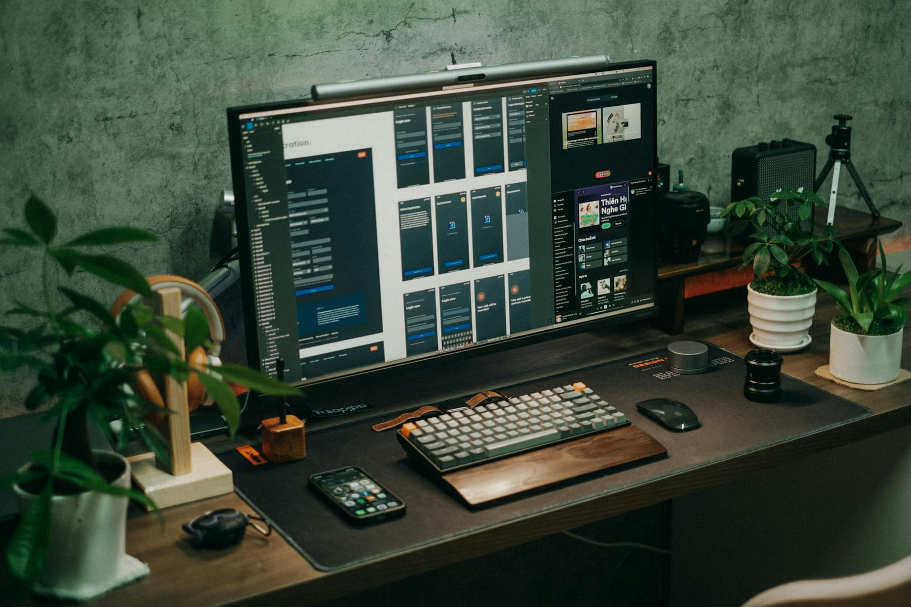 A tidy office desk featuring a computer monitor, keyboard, and plants for a modern workspace vibe. on The Tech Shelf