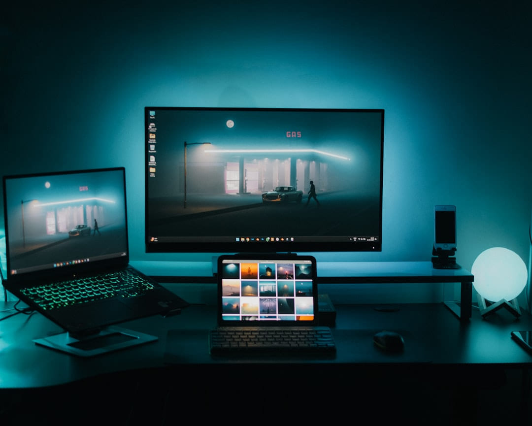 A desk with two monitors and a laptop on The Tech Shelf